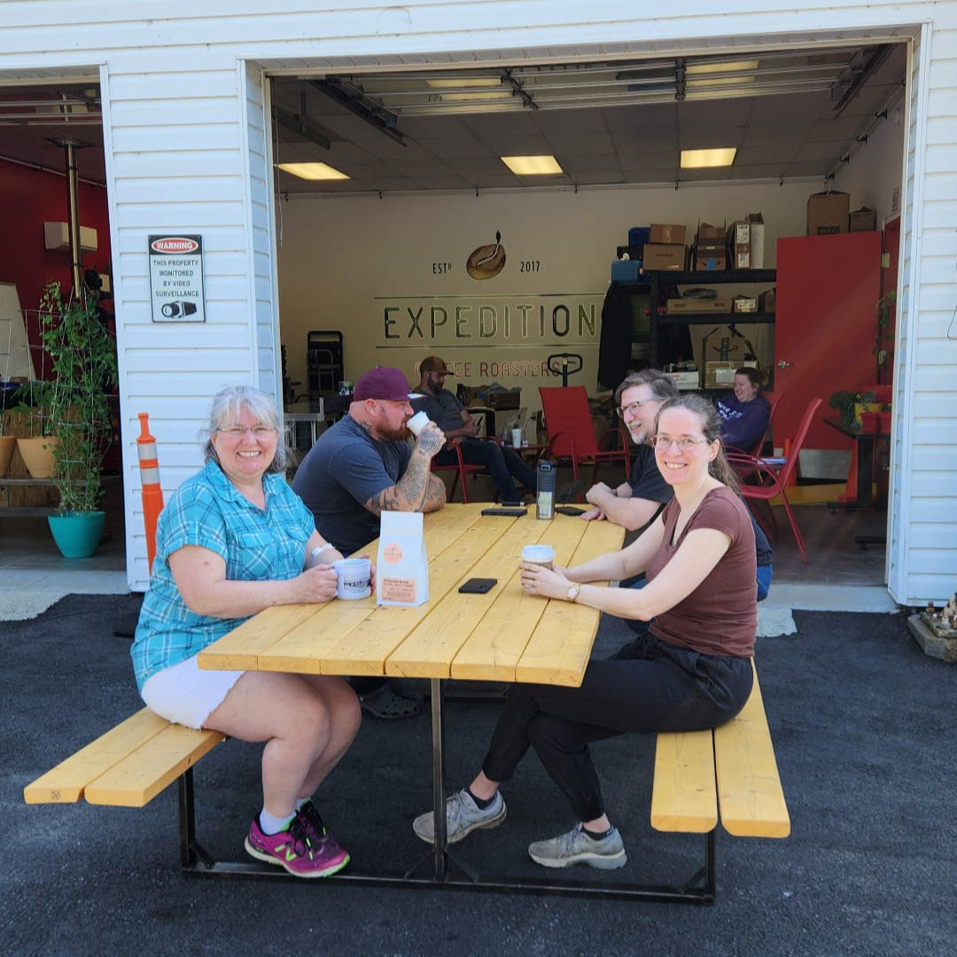 customers drinking coffee at expedition coffee roasters on the patio